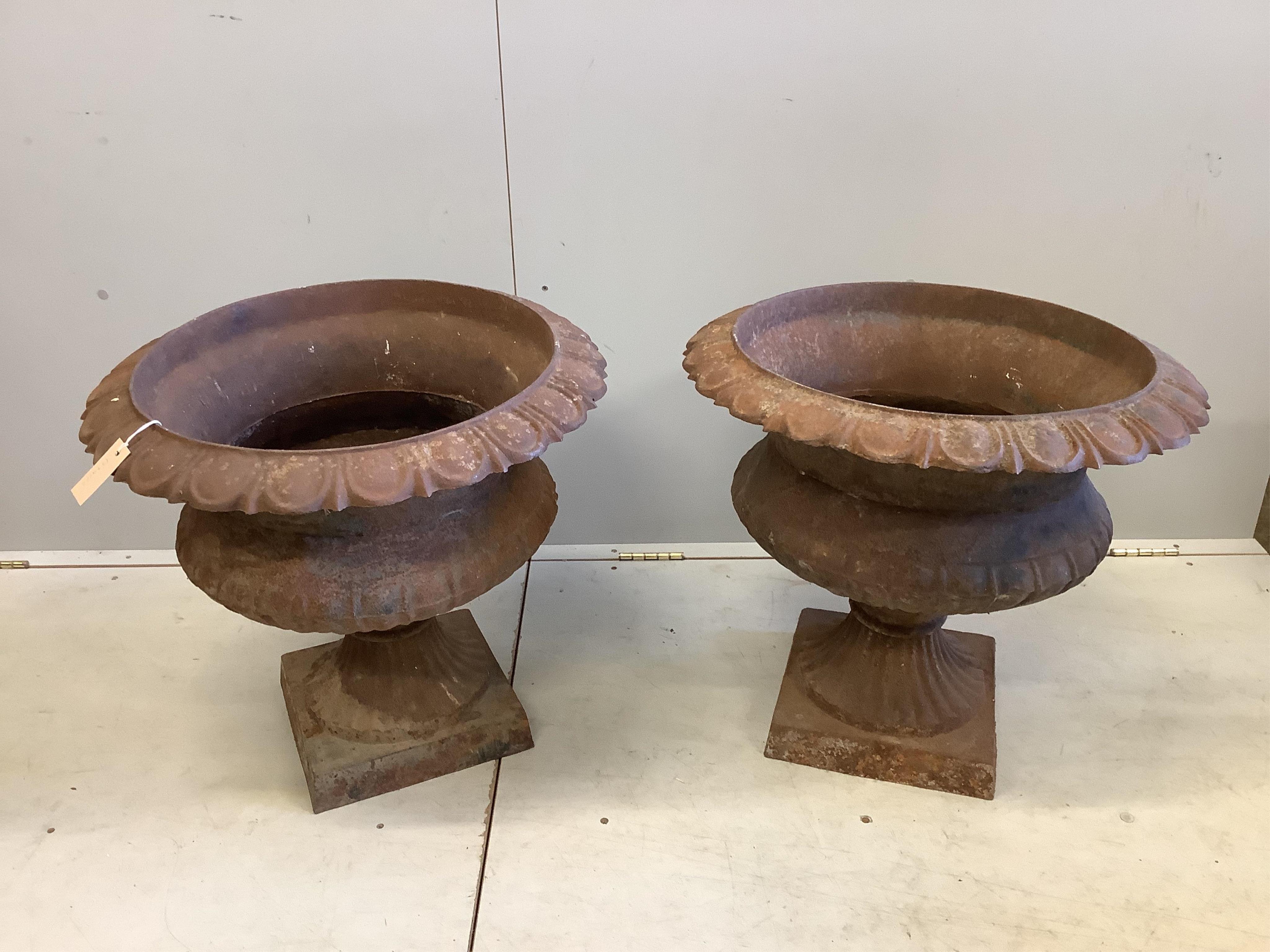 A pair of Victorian cast iron campana garden urns, diameter 60cm, height 53cm